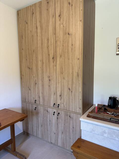 Tall wooden wardrobe