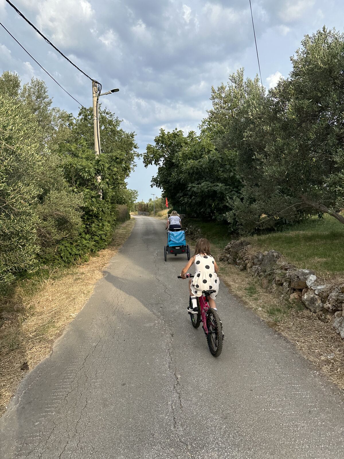 A cyclist on the quiet road near the house
