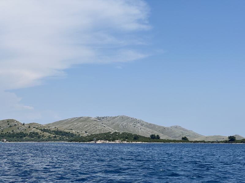 Bare limestone hills of Telašćica rising from the sea